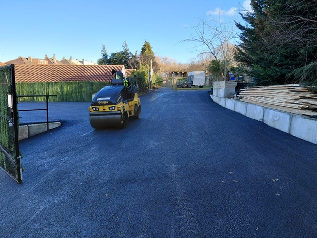 Carthy Contracting roller compacting a newly laid tarmac access road