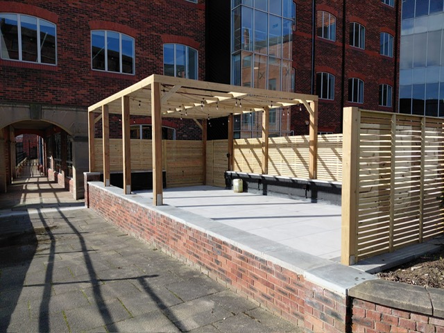Paved terrace and retaining brickwork on a Leeds waterside development